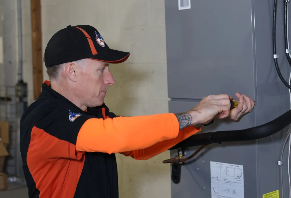 Perfect Timing Heating & Cooling technician performing heating repair on a residential heating system to restore reliable and efficient home comfort