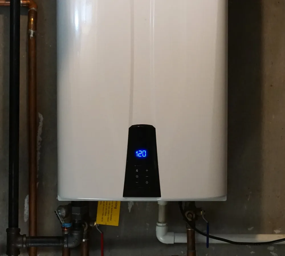 Perfect Timing Heating & Cooling tankless water heater installed in a home to provide reliable and energy-efficient hot water